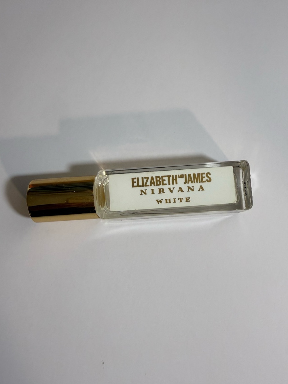 Elizabeth and James Nirvana White Rollerball - White with Gold Cap